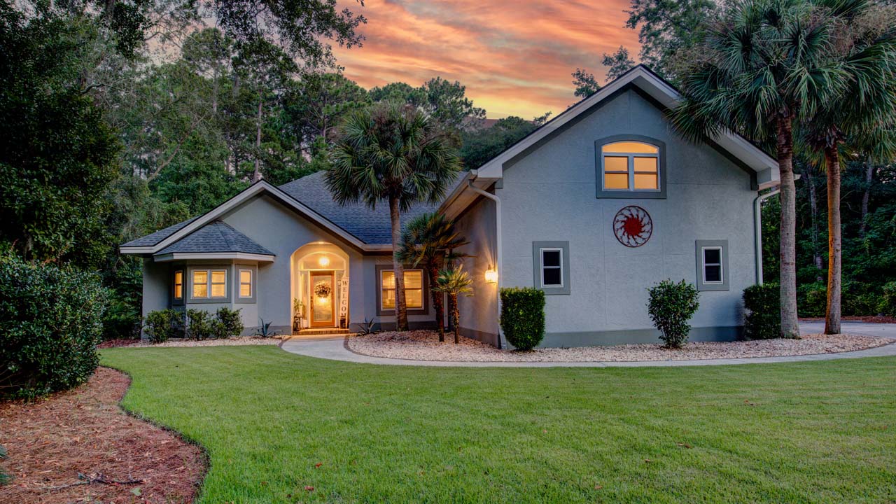 Real Estate Photography - Exterior of Home For Sale at Twilight / Dusk on Hilton Head Island, South Carolina (SC)